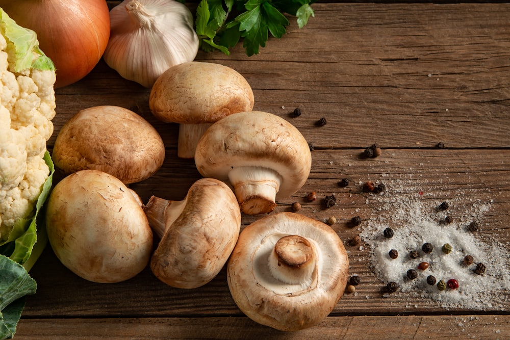 brown mushrooms on gray wooden table.