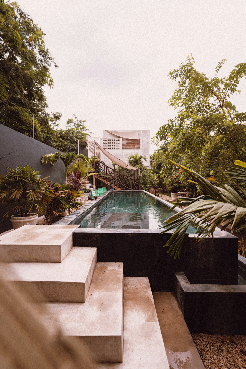 white concrete building near swimming pool during daytime