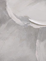 Softly lit image of a contemporary painting with subtle brushstrokes in cool grays.