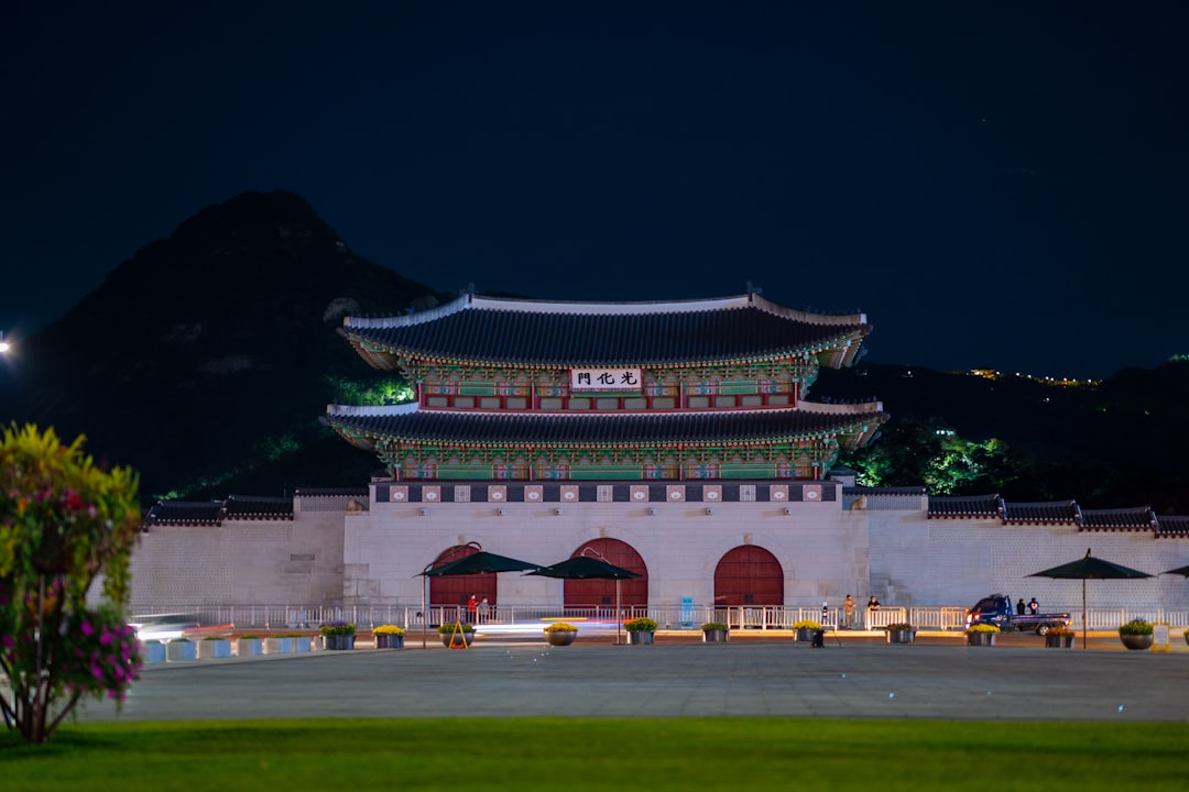 white and red concrete building during nighttime