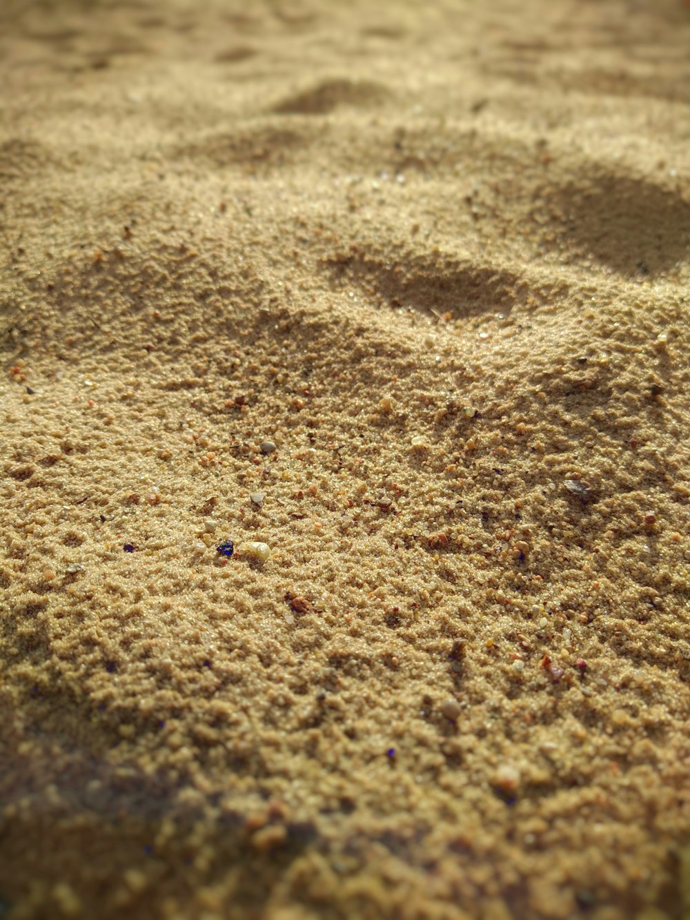 blue stone on brown sand