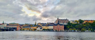 A vibrant view of Panama City's skyline with the historic Casco Viejo in the foreground under a bright blue sky.