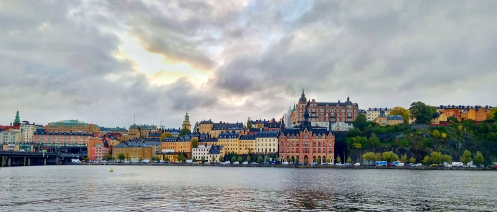 A vibrant view of Panama City's skyline with the historic Casco Viejo in the foreground under a bright blue sky.