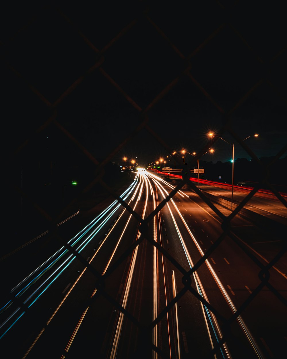 time lapse photography of cars on road during night time