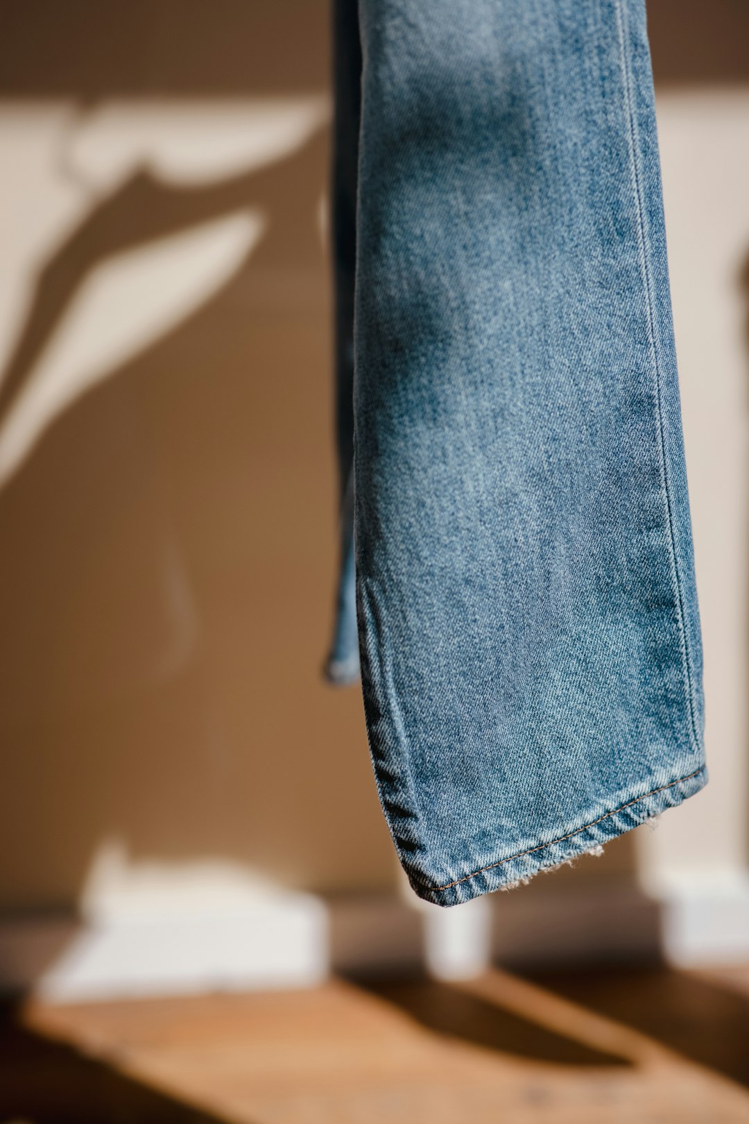 blue denim jeans on black plastic clothes hanger