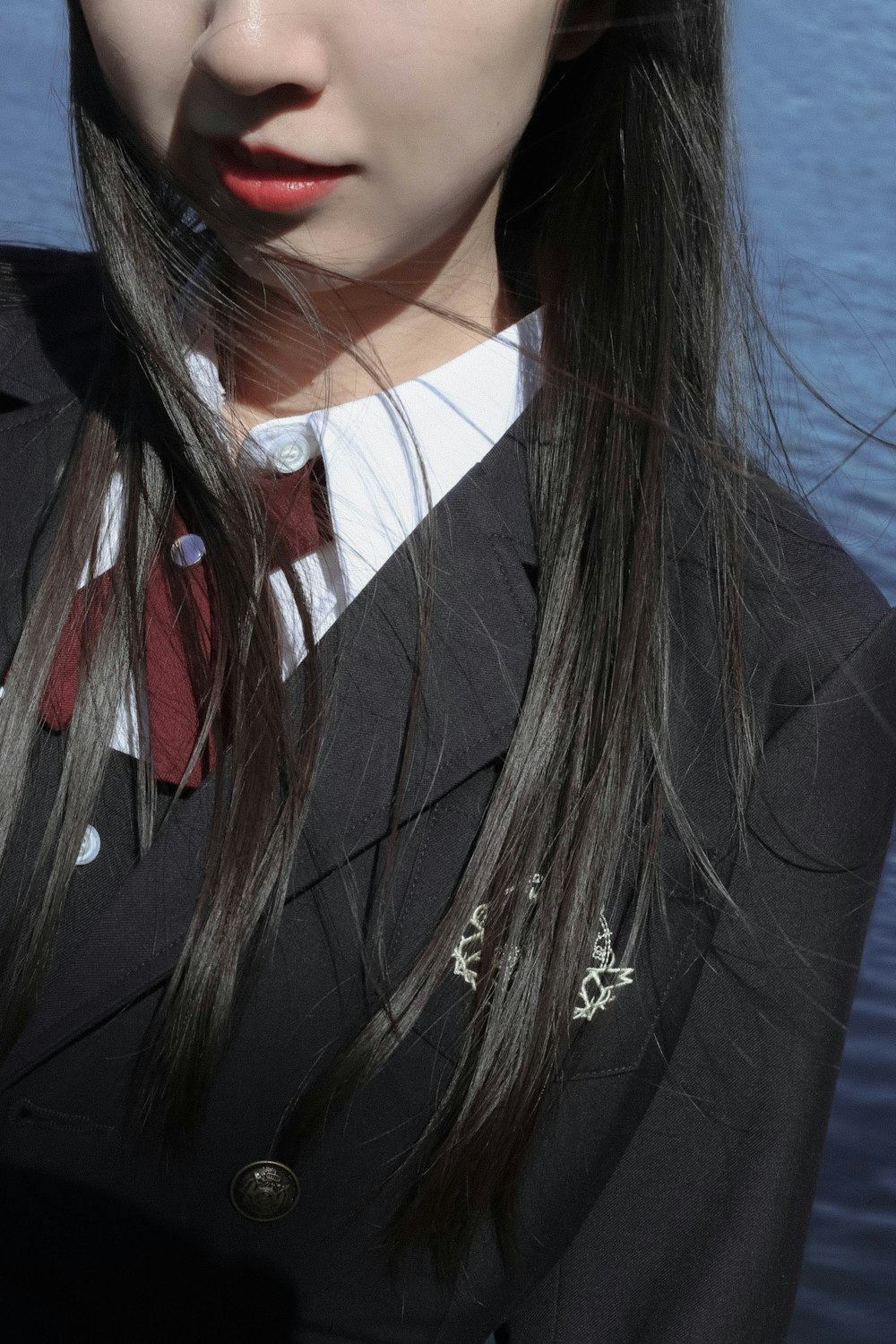 woman in black blazer and white shirt