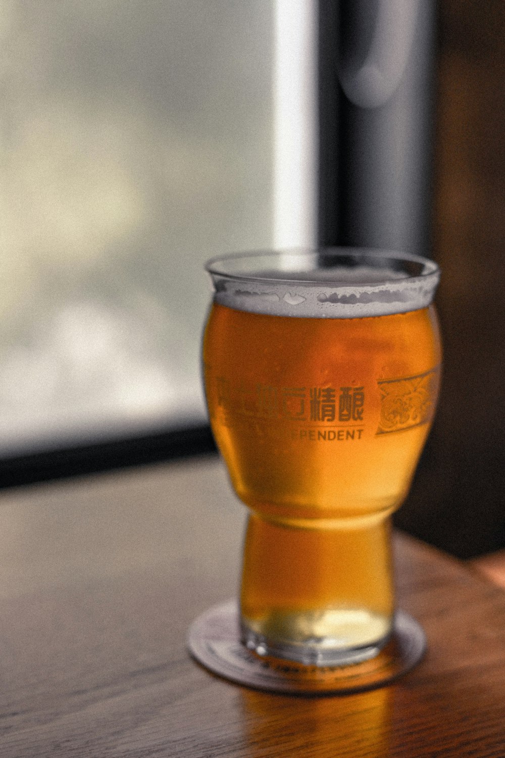 clear drinking glass with brown liquid