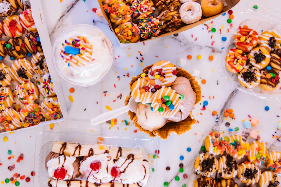 assorted doughnuts on white ceramic plate