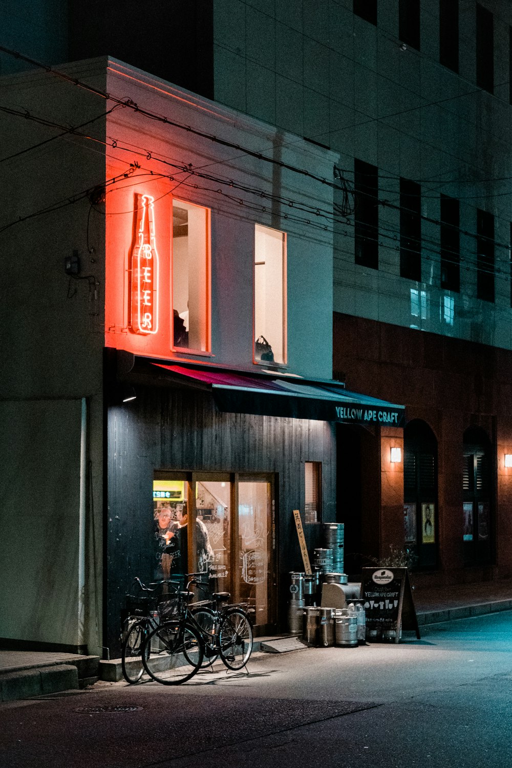 red and white store front during night time