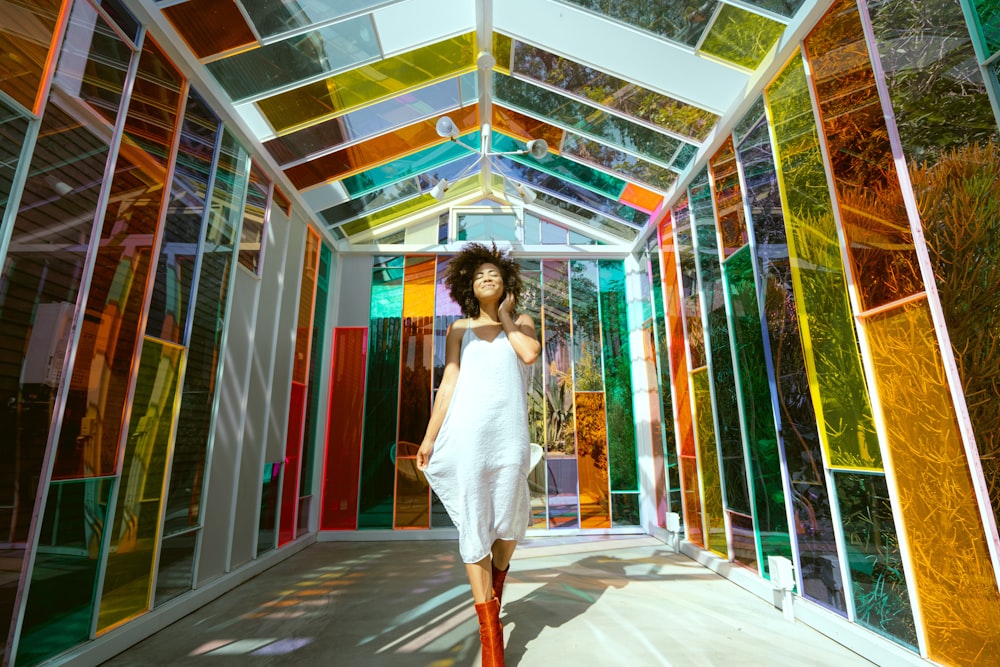 woman in white dress standing on hallway