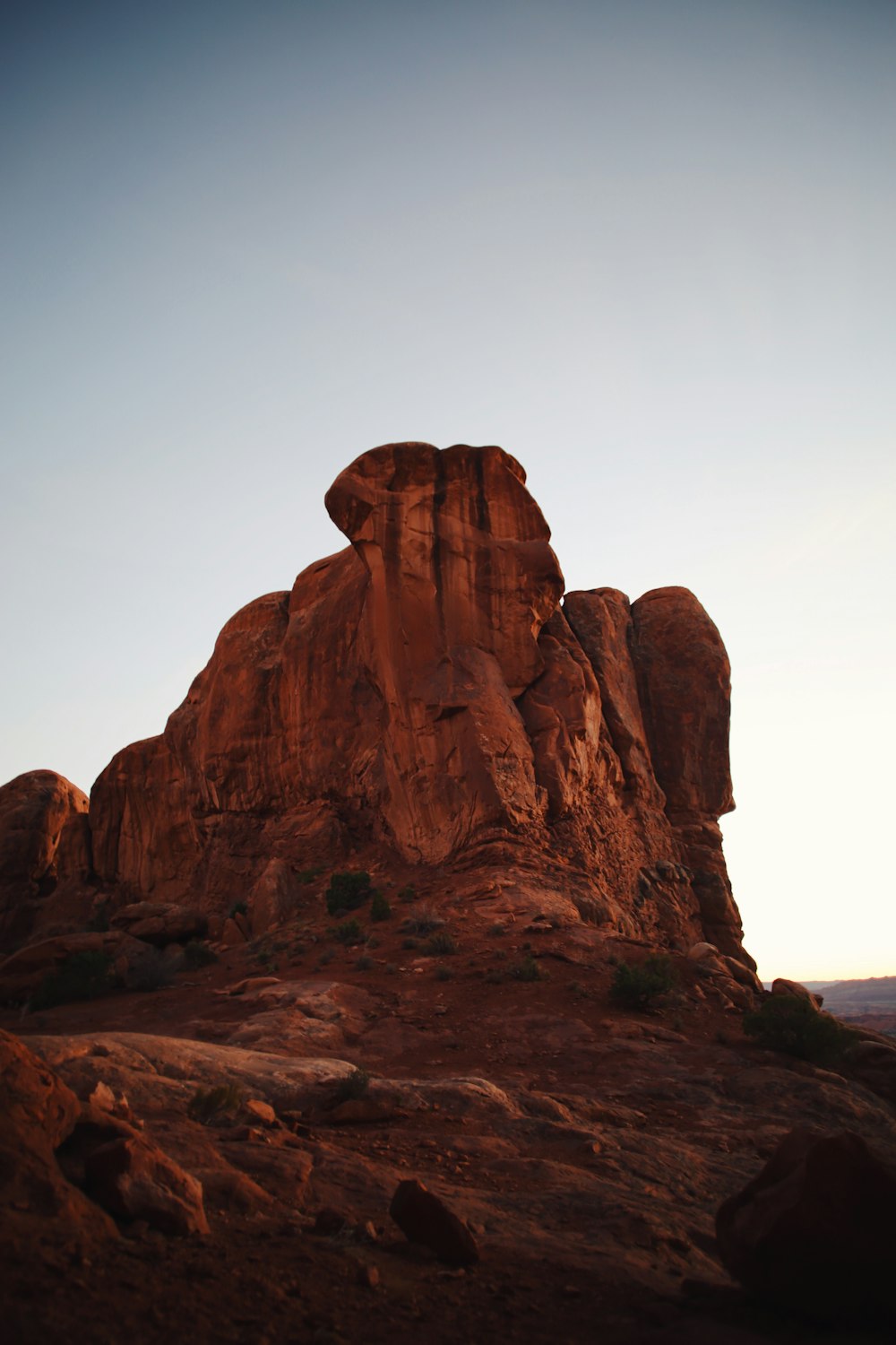 brown rock formation under white sky during daytime