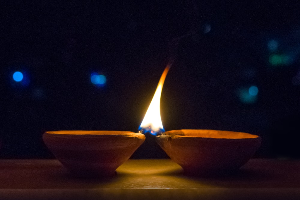 2 blue ceramic bowls on yellow surface