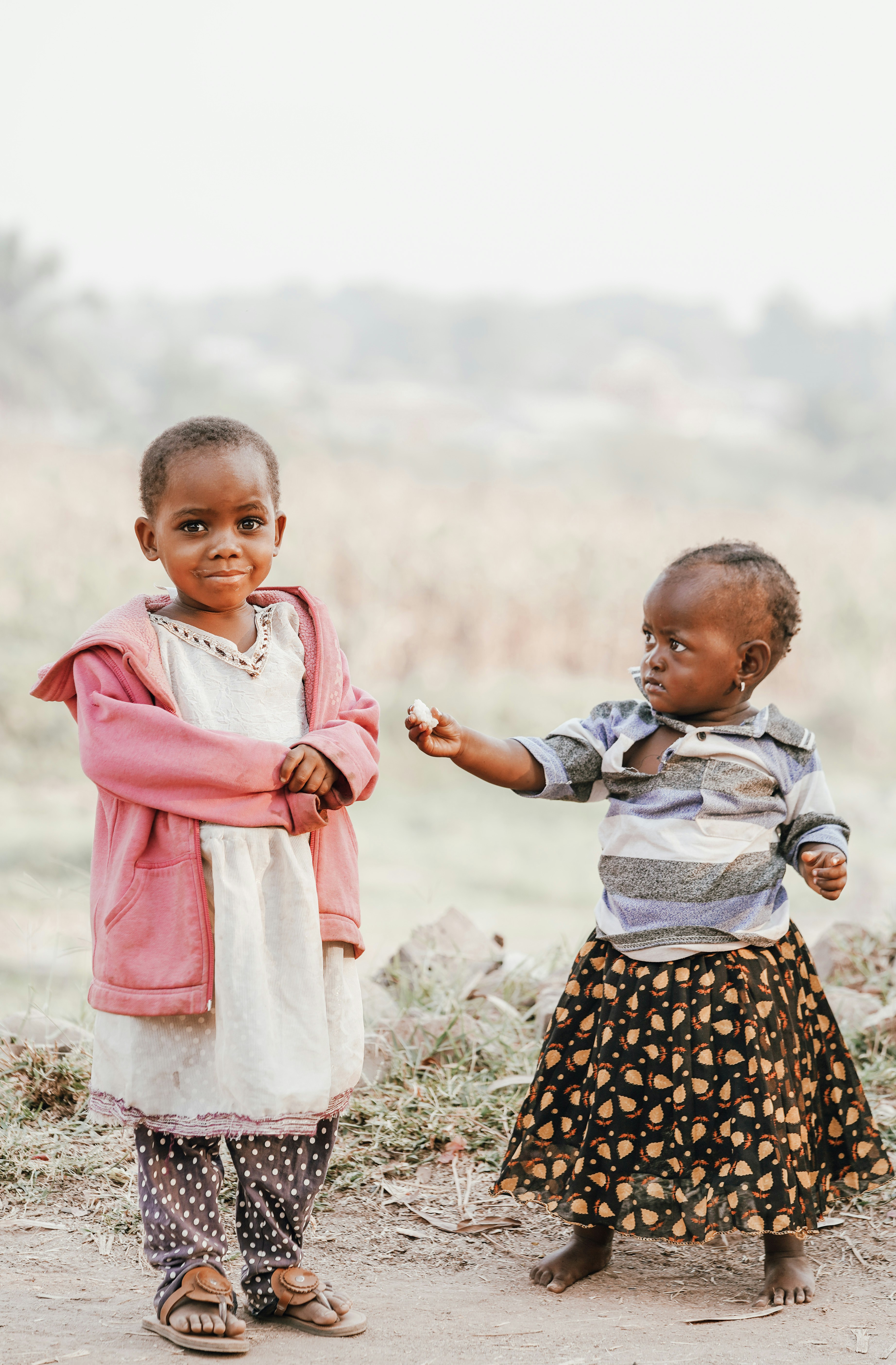 Two young girls hugging and smiling