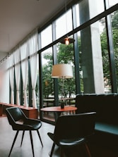 Interior of a modern, cozy service apartment with stylish furniture and natural light.