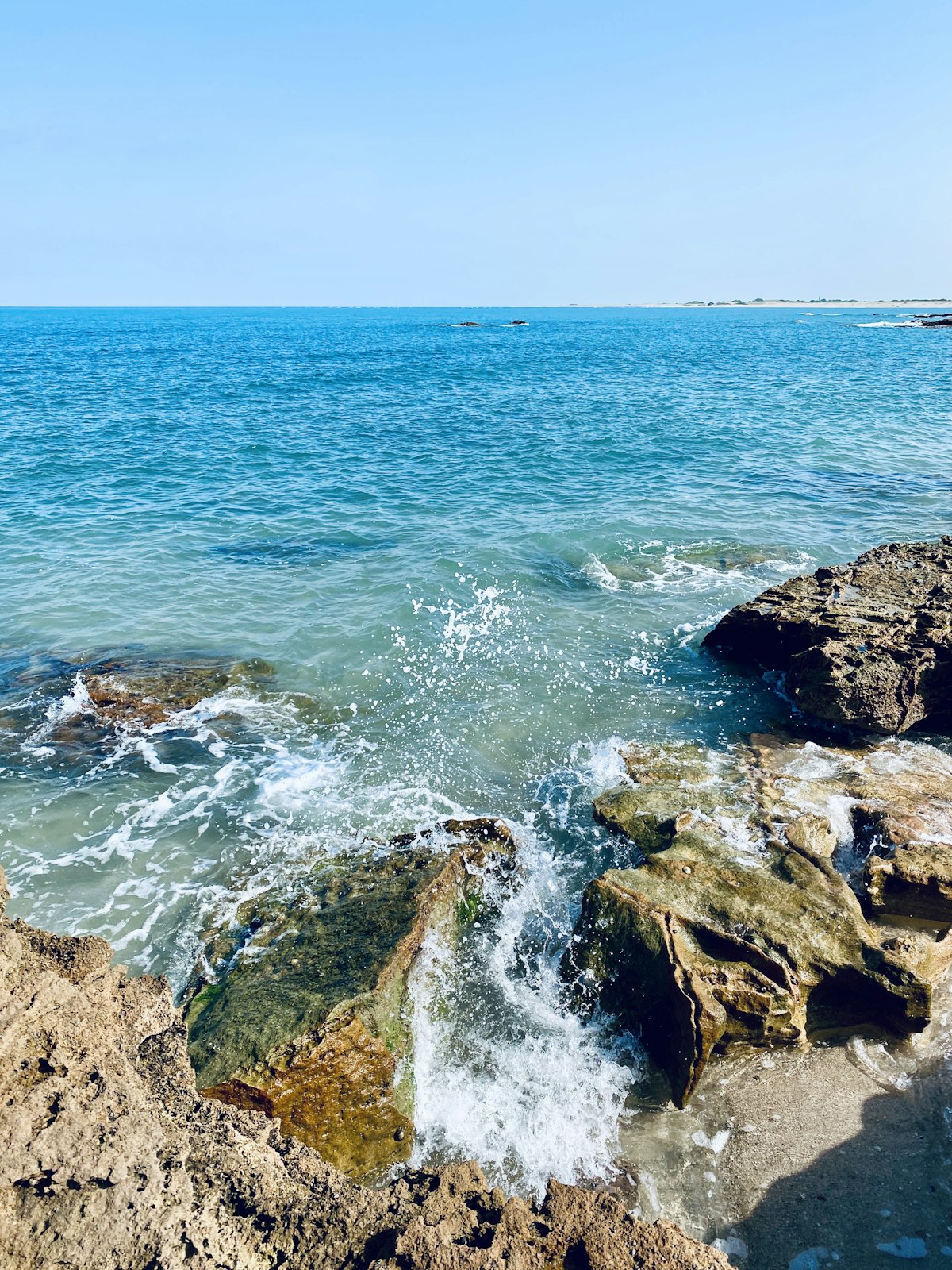 Waves on the rocky Okhamandal coast near Dwarka