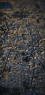 Aerial view of a cityscape with highlighted zones indicating areas of recent data-driven interventions.