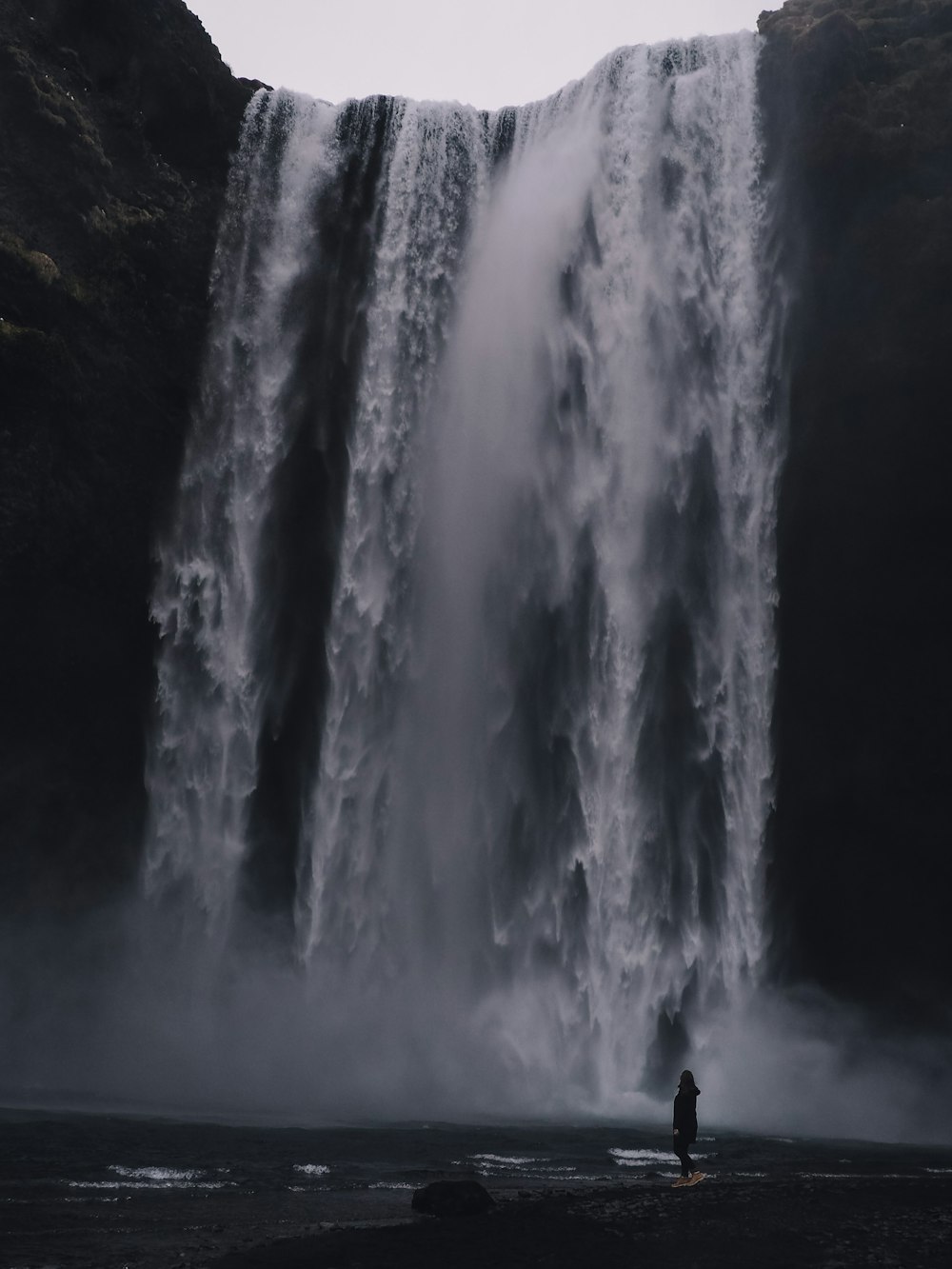 water falls in the middle of the forest