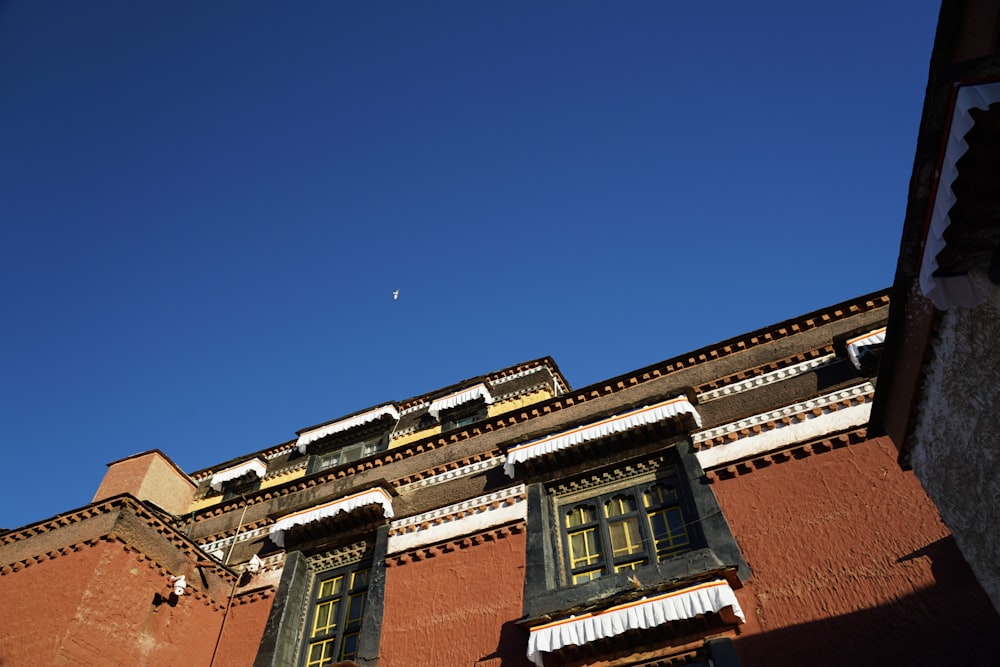 brown concrete building under blue sky during daytime