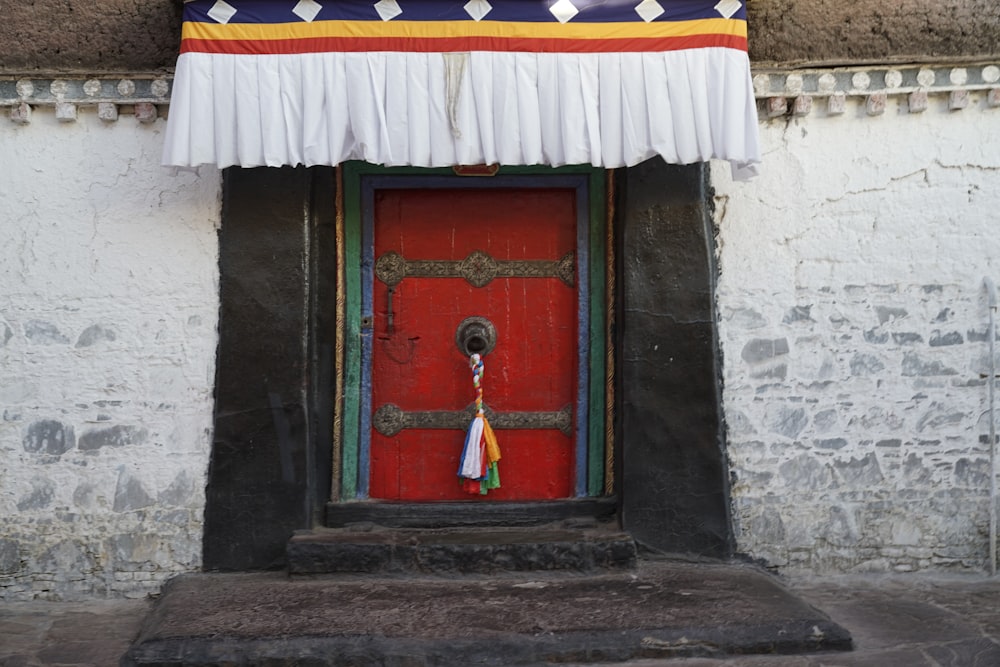 red white and blue flag on red wooden door