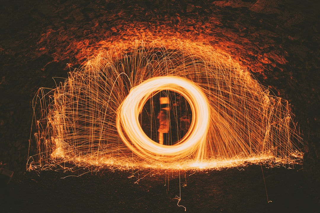 time lapse photography of person standing on tunnel