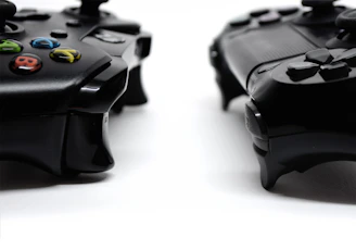black game controller on white surface