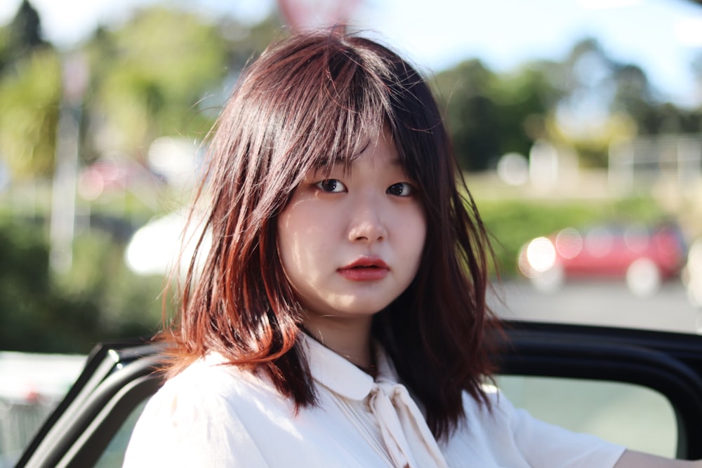 girl in white button up shirt