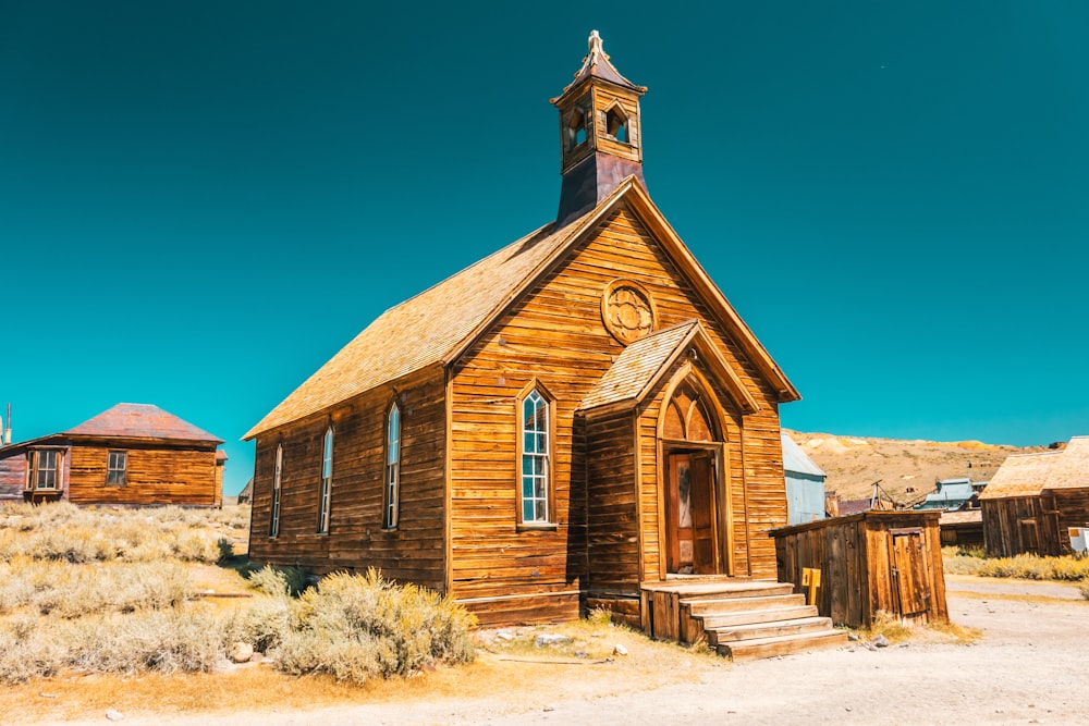 brown and gray concrete church under blue sky during daytime