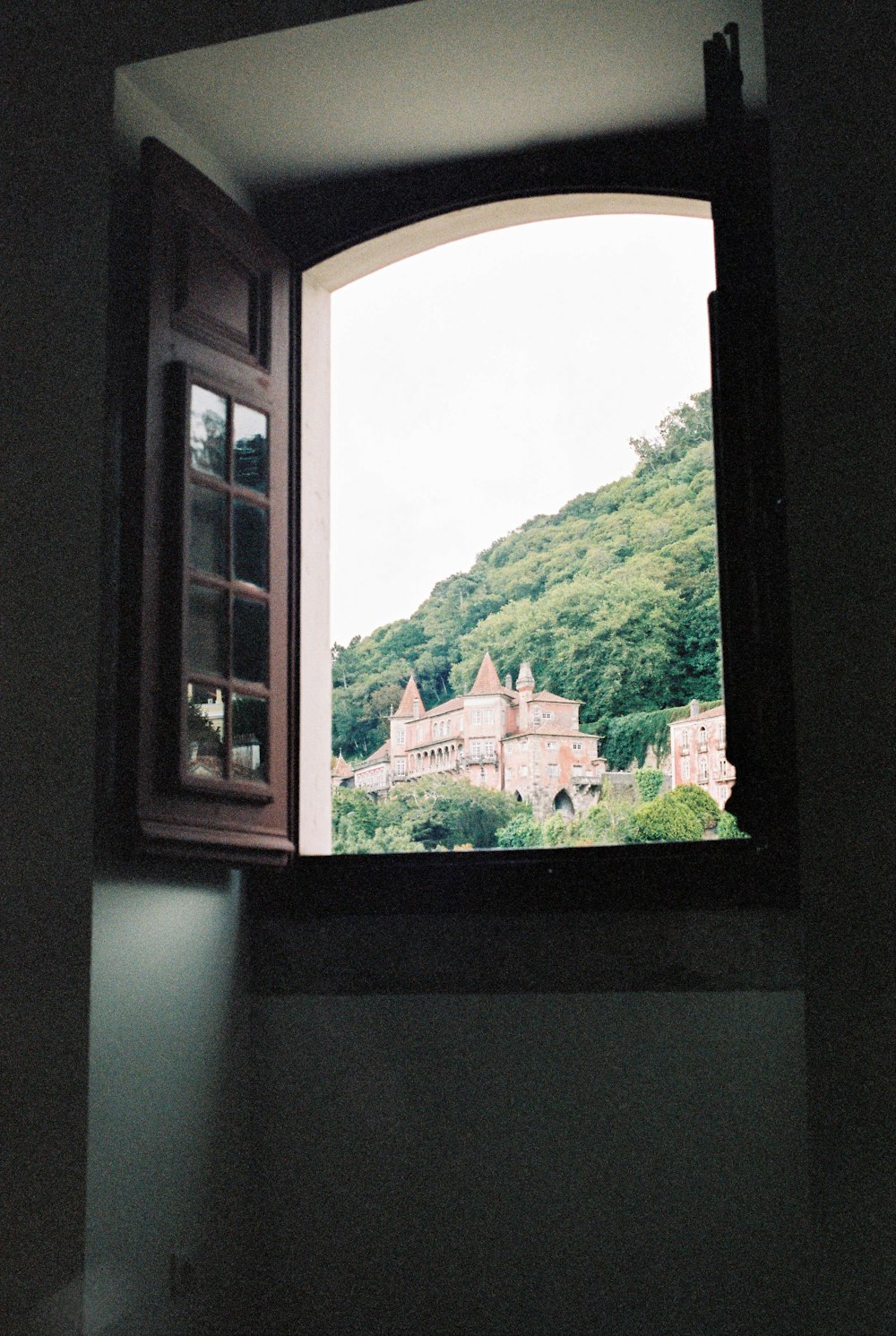 brown wooden framed glass window