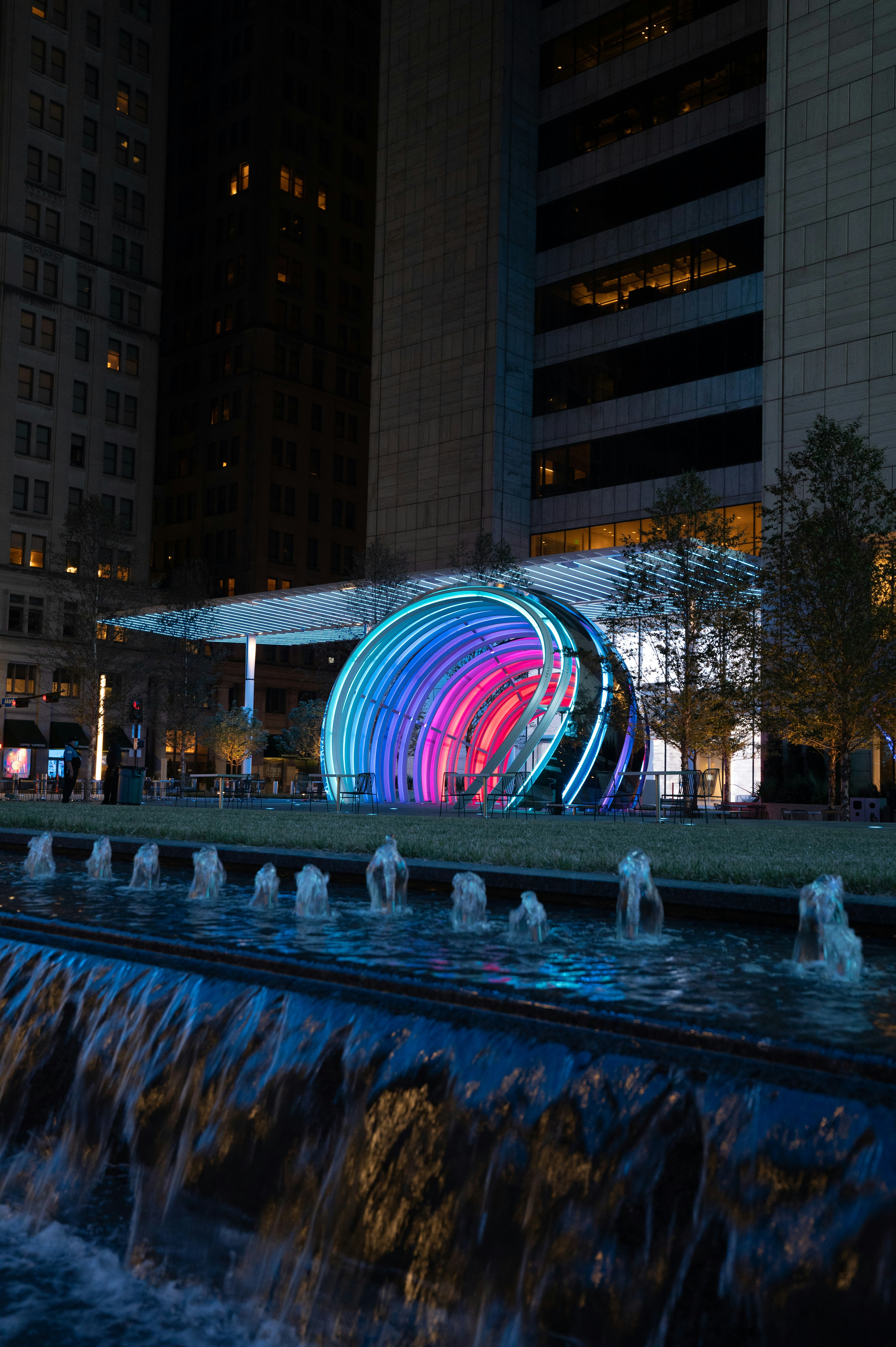 water-fountain-in-the-middle-of-the-city-during-night-time