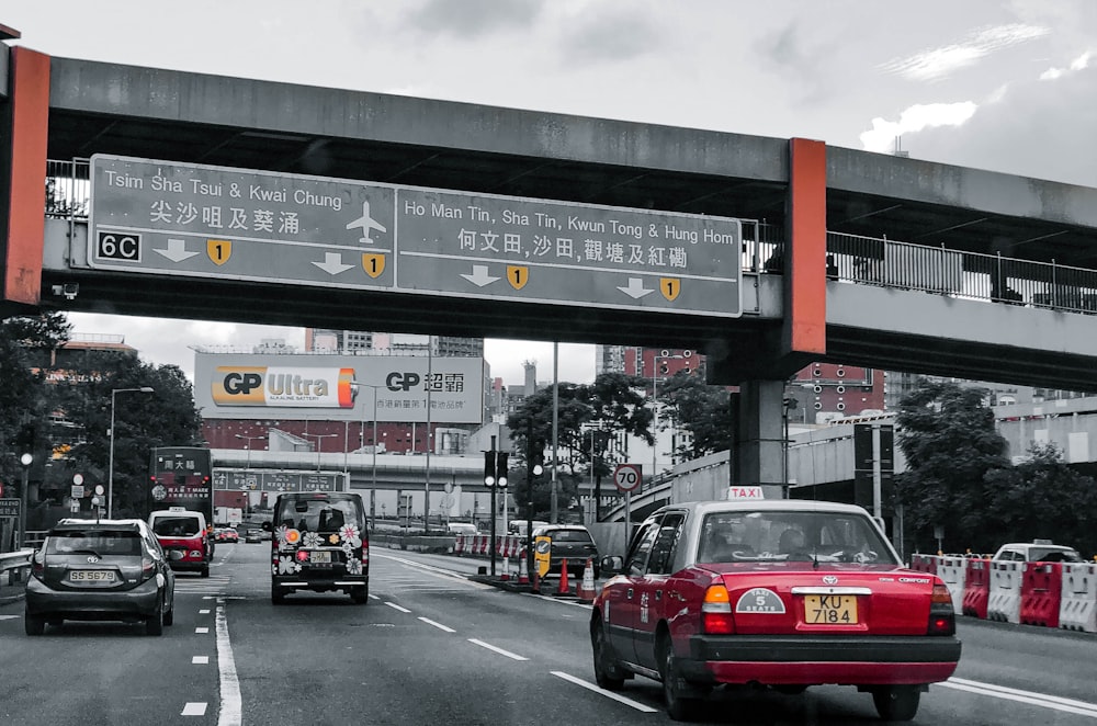 red car on road during daytime