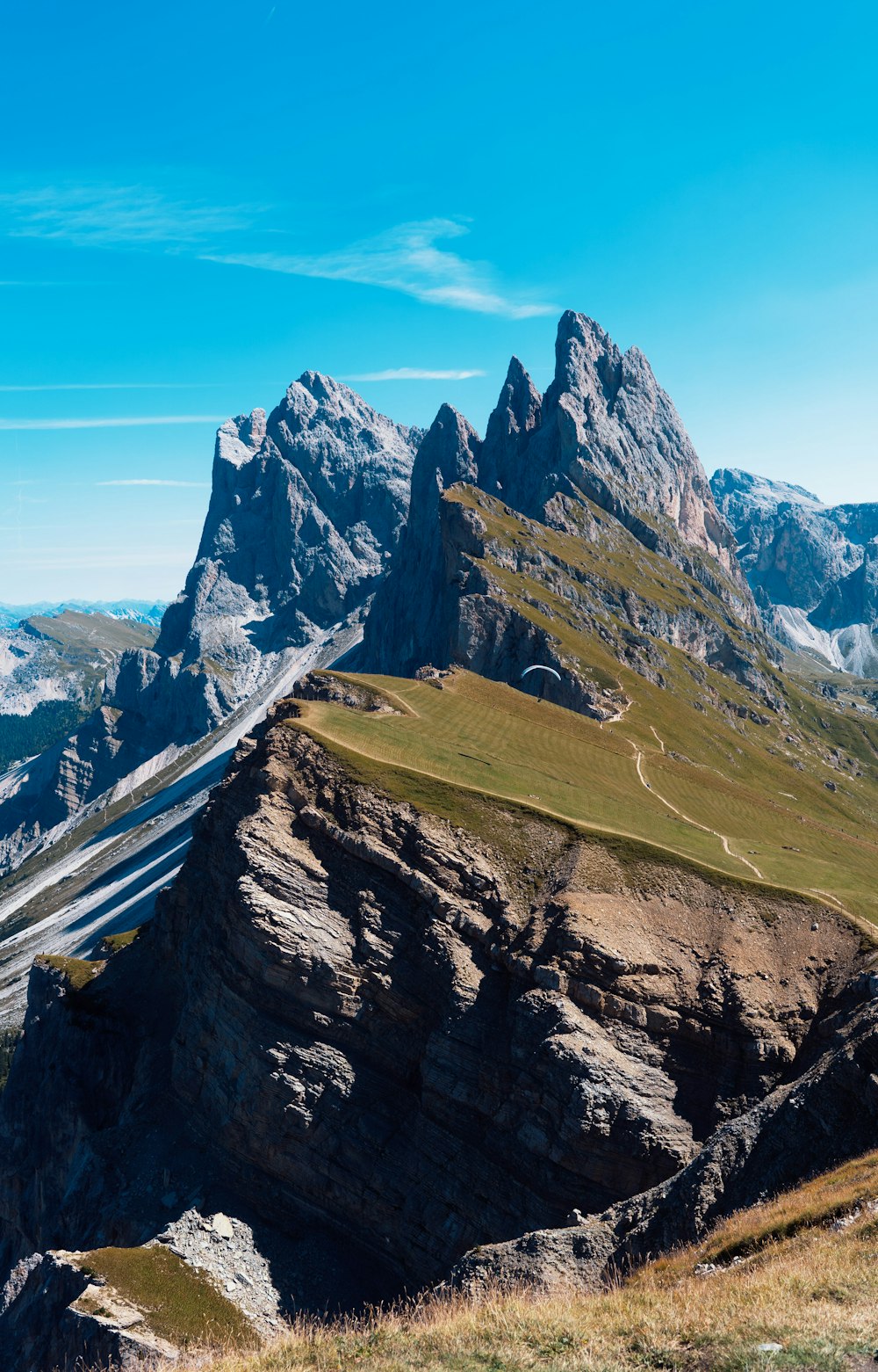 gray concrete road on mountain during daytime