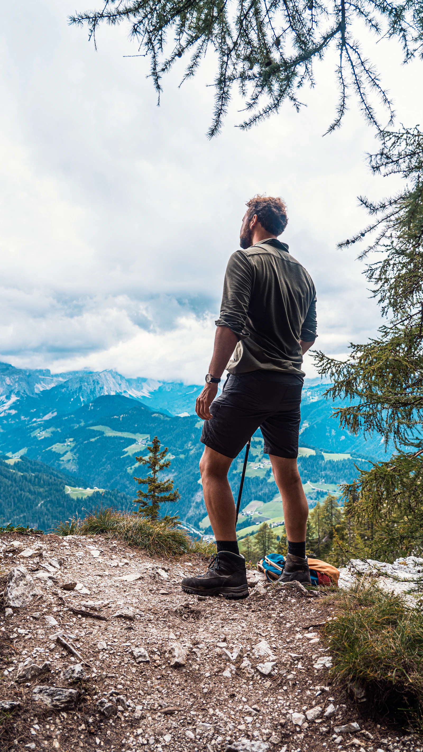 Hiker looking across alpine mountains