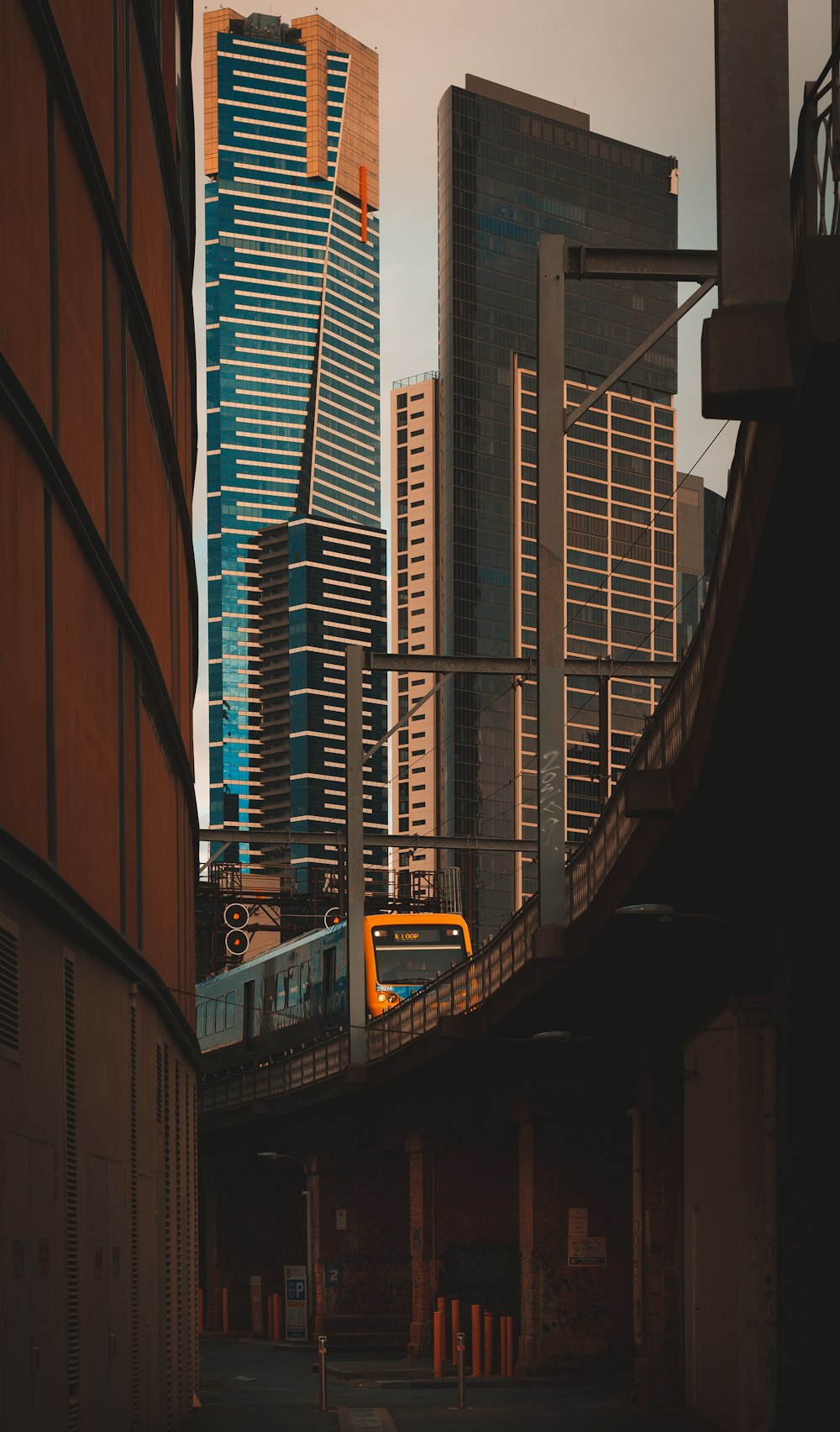 black and yellow train in the city during daytime