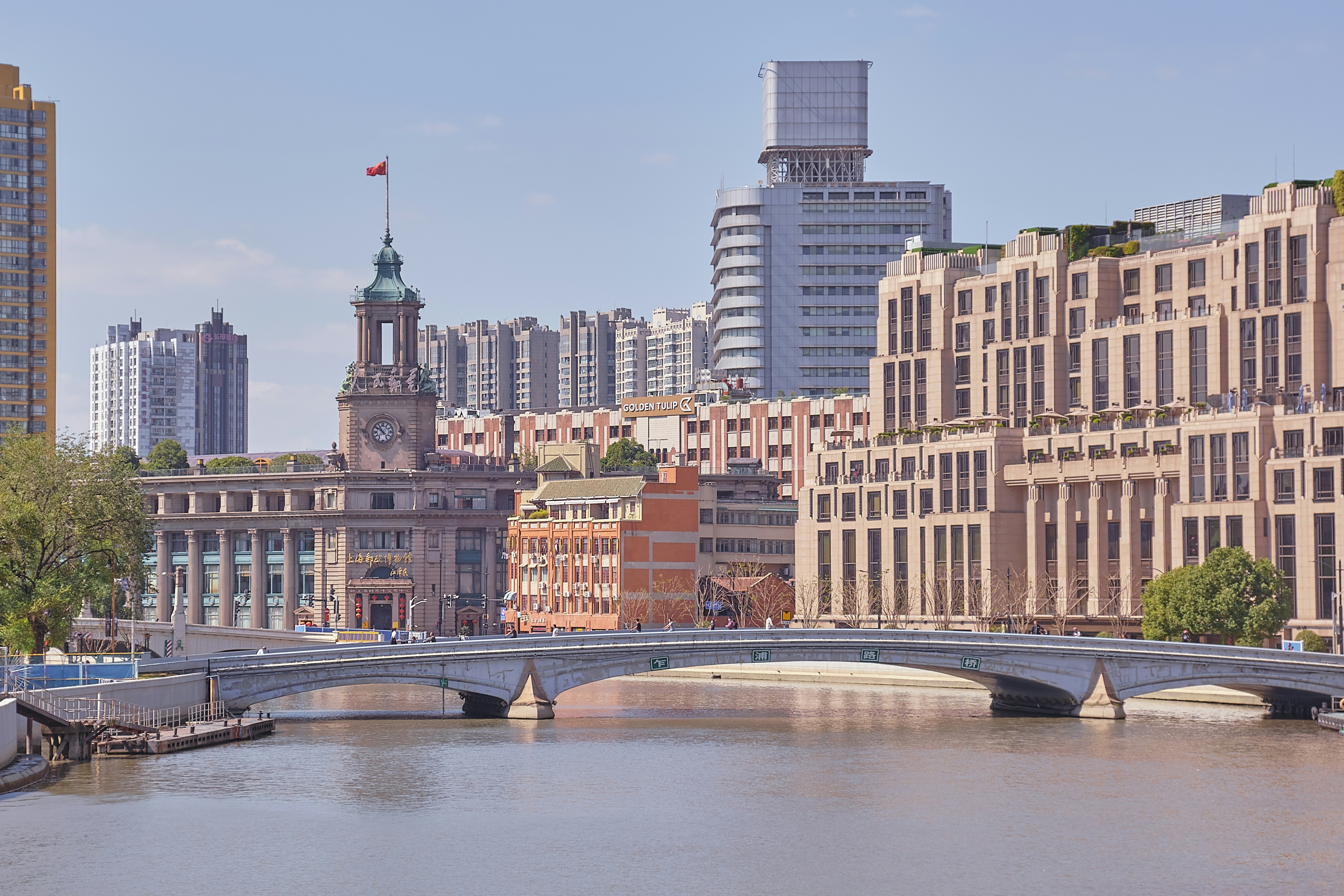 Brown concrete building near river during daytime photo – Free Shanghai ...