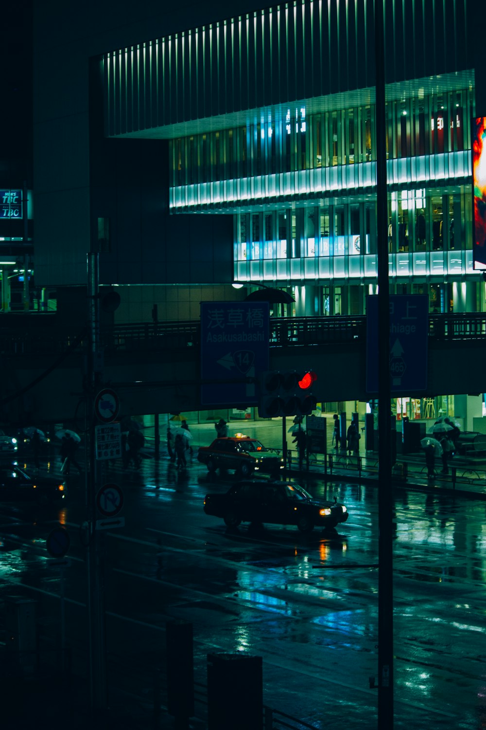 cars on road near buildings during night time