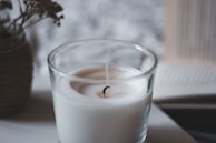 white liquid in clear drinking glass
