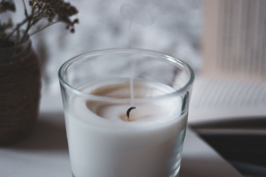 white liquid in clear drinking glass