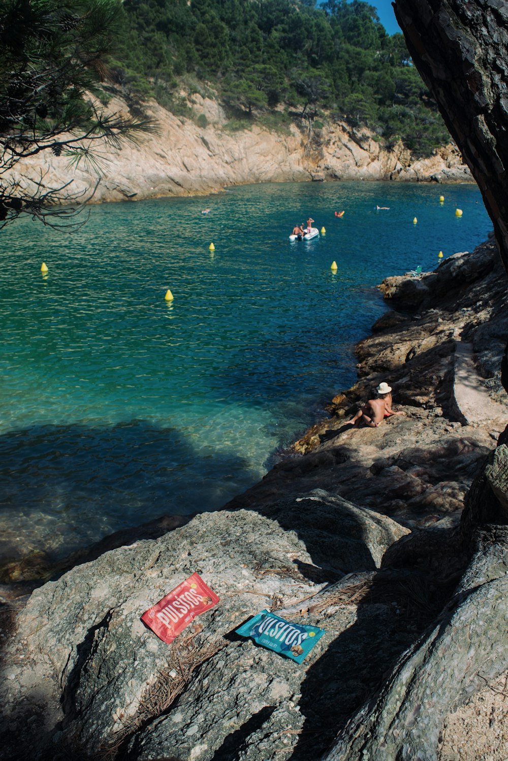 people swimming on sea during daytime