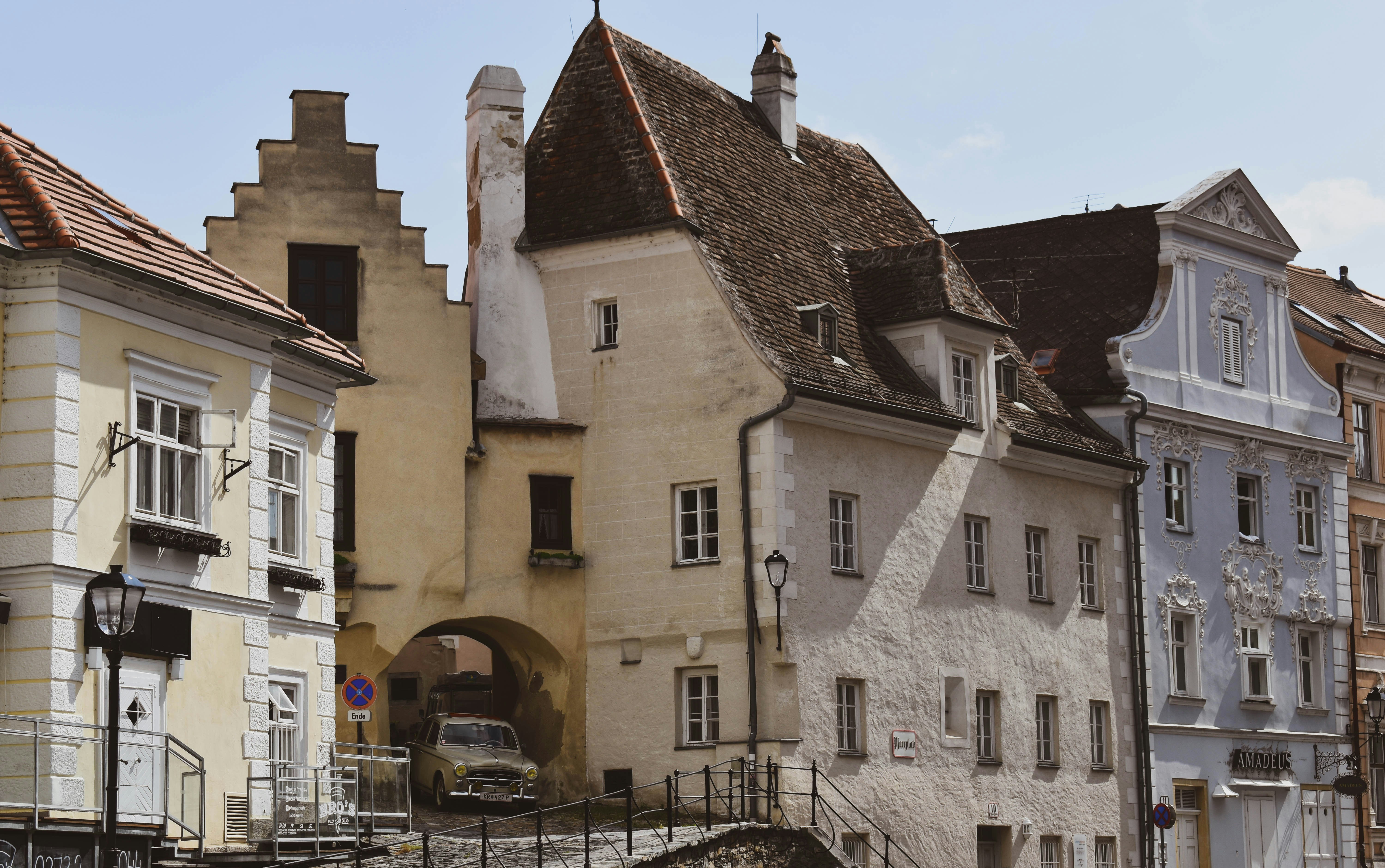 white and brown concrete building during daytime österreich teams background