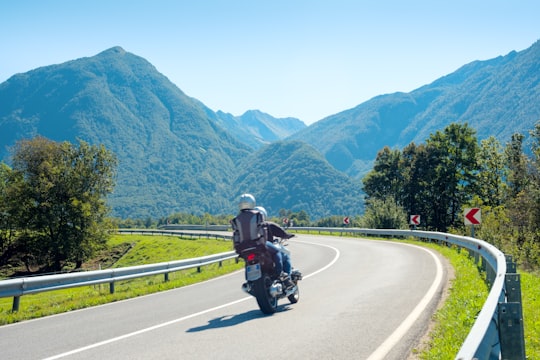man riding motorcycle on road during daytime in Bovec Slovenia