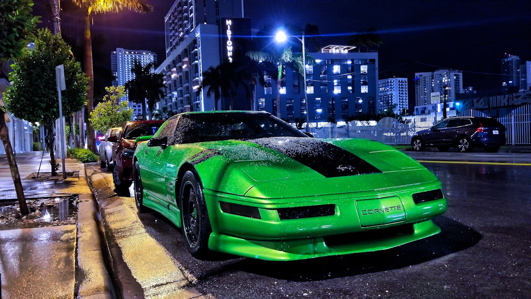 green porsche 911 parked on street during night time