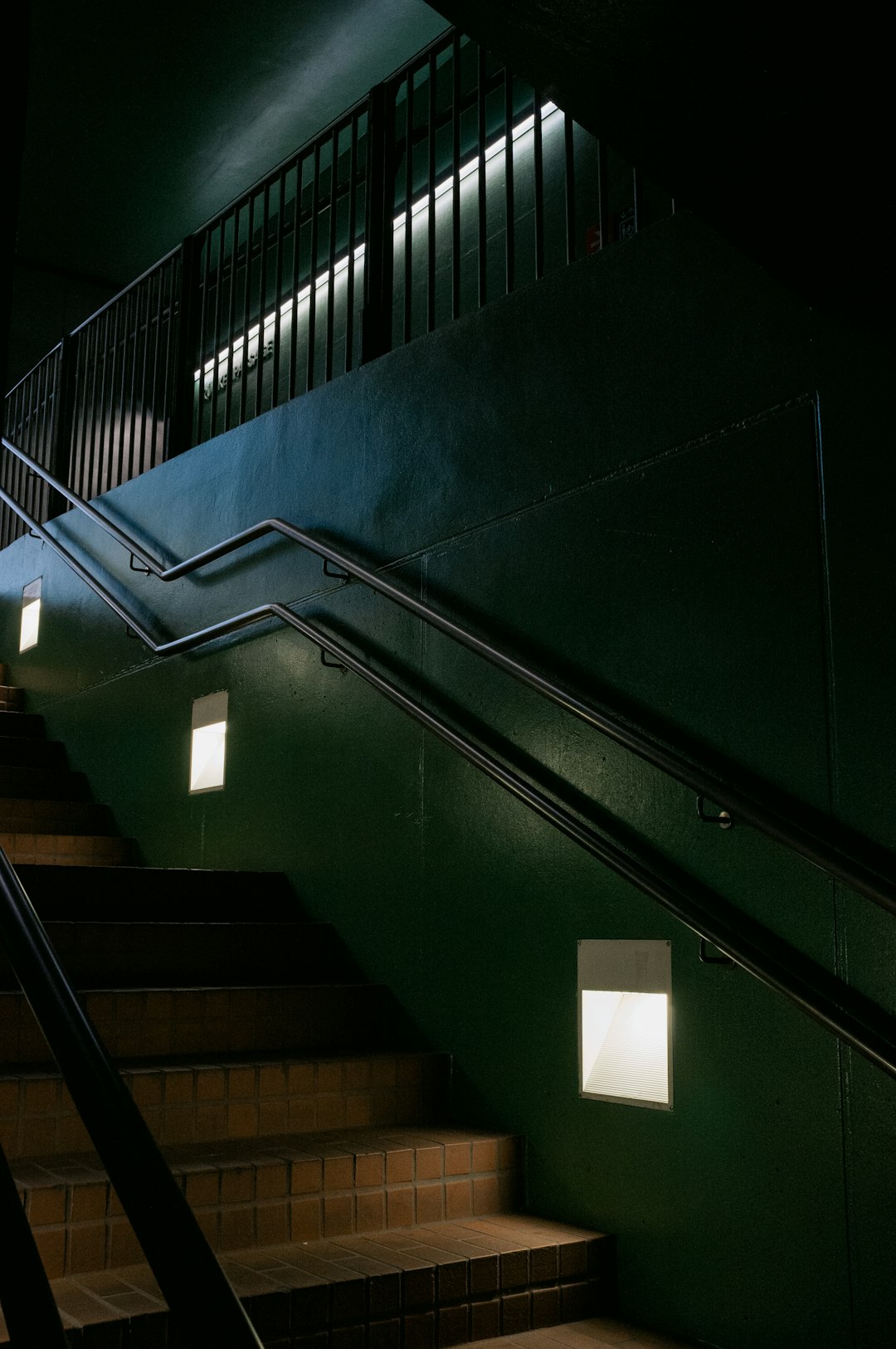 black staircase with stainless steel railings