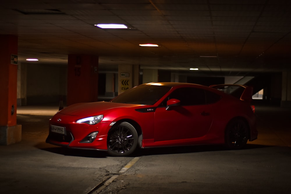 red porsche 911 parked in building