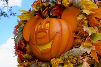 orange jack o lantern on brown wooden table