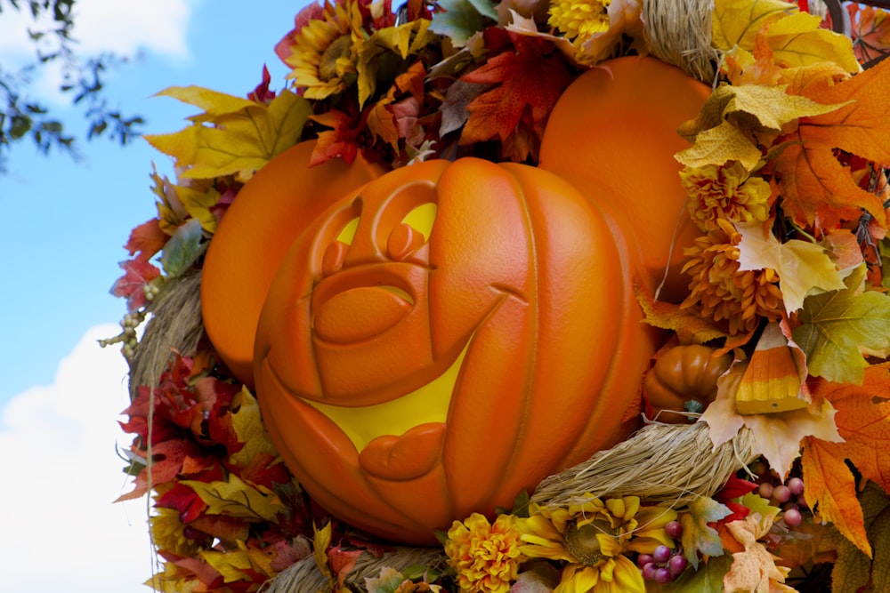 orange jack o lantern on brown wooden table