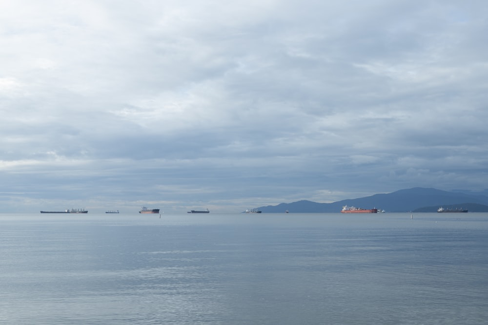 body of water under cloudy sky during daytime