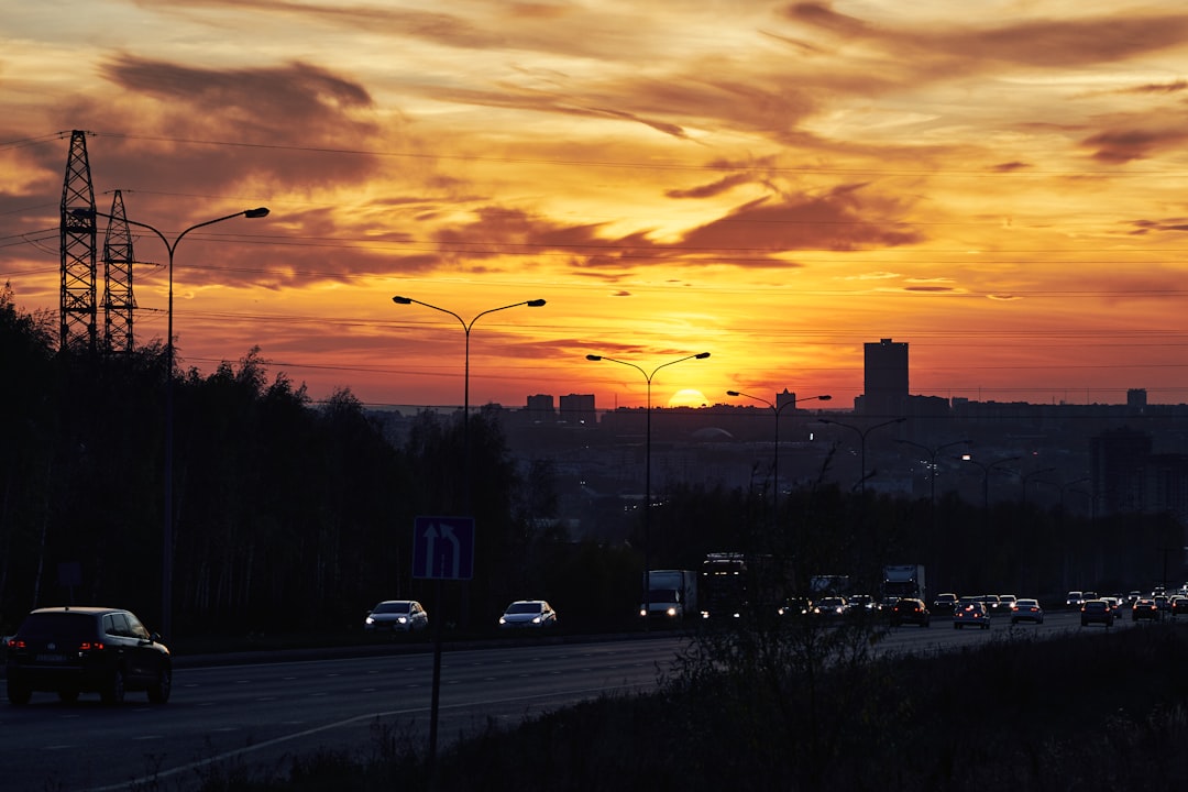 cars on road during sunset