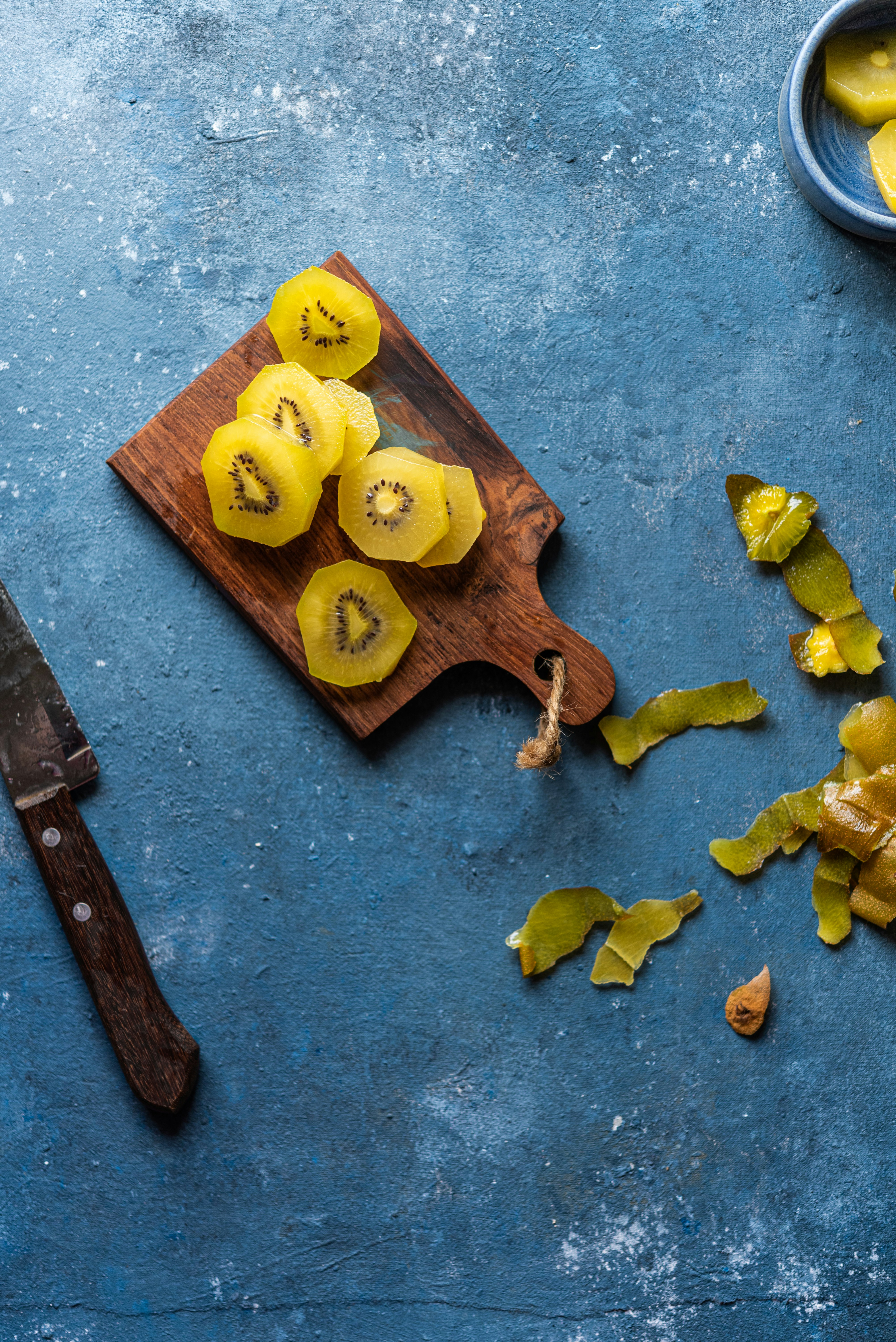 sliced cheese on brown wooden chopping board