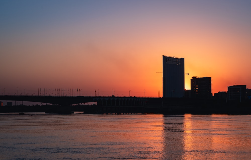 silhouette of building during sunset