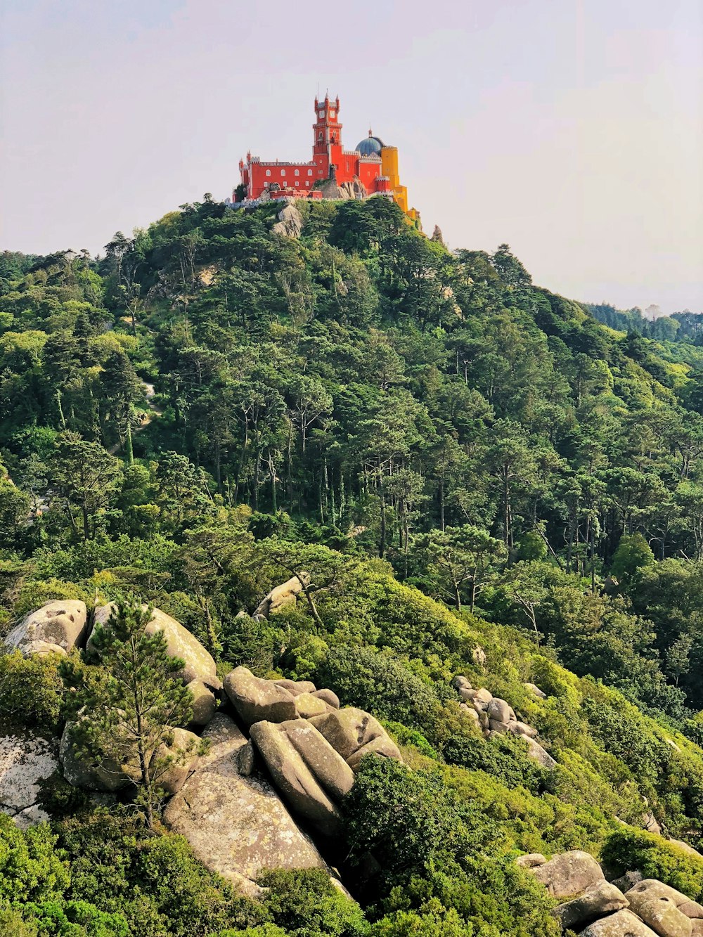 orange concrete building on top of mountain